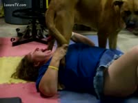 MILF giving blowjob to a dog